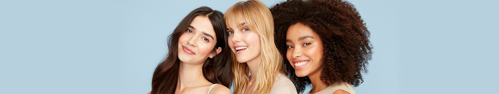 Three diverse women with healthy skin standing side by side Three diverse women with healthy skin standing side by side