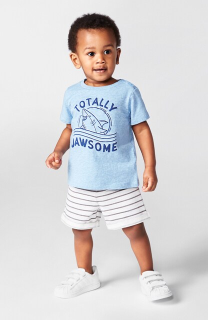toddler in graphic tee and knit shorts