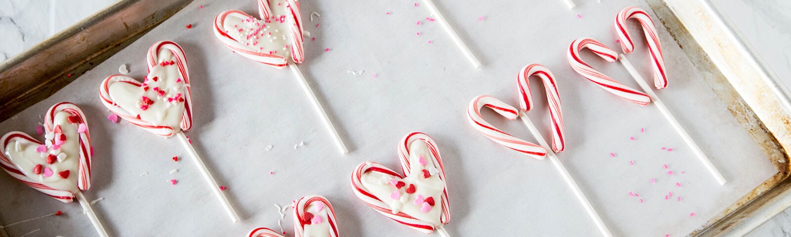 Candy cane lolipops on baking pan Candy cane lolipops on baking pan